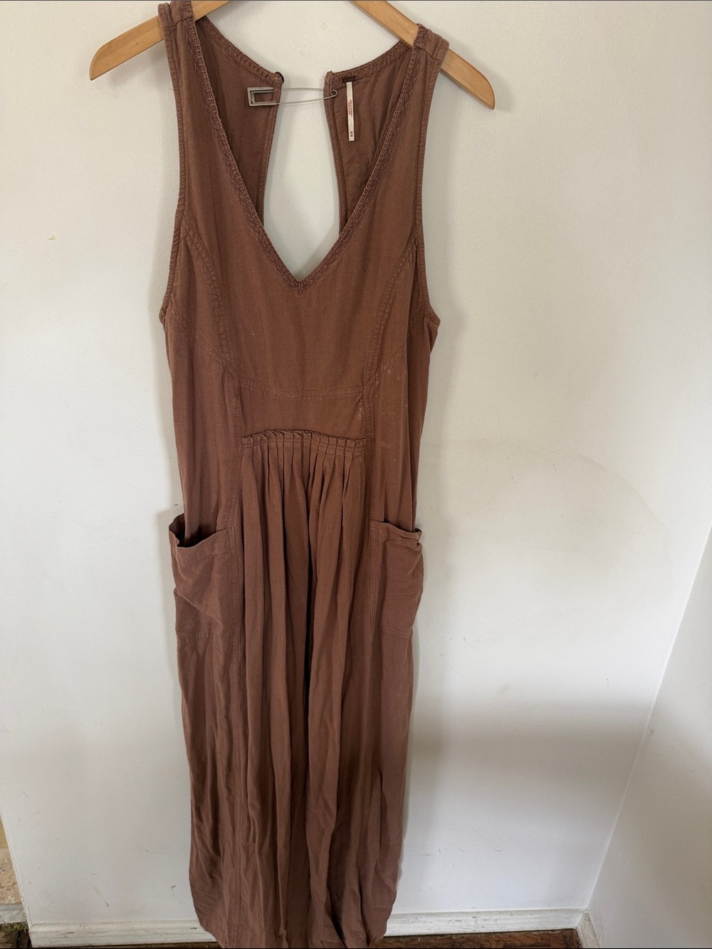 Free People brownish clay color flowing jumpsuit.